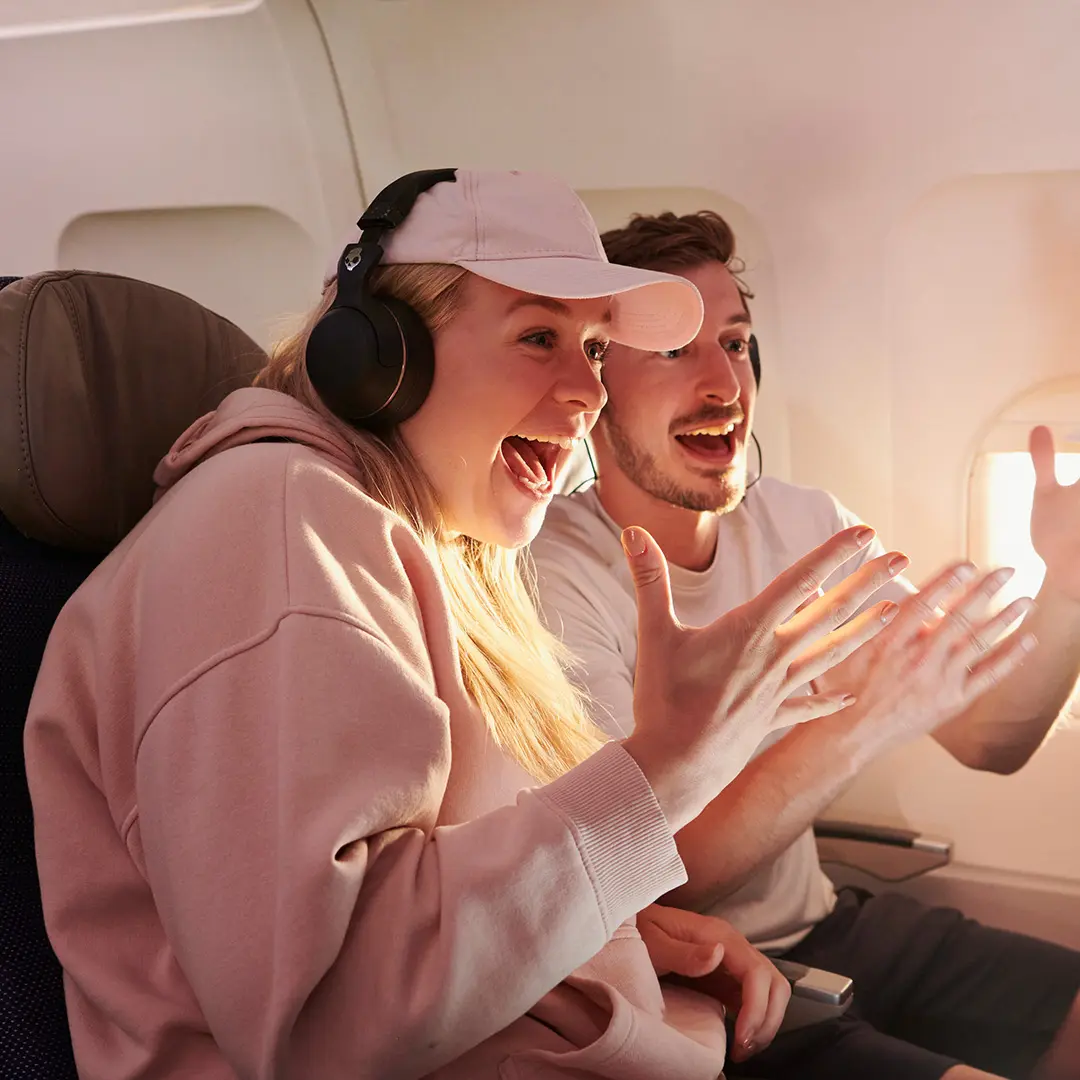 Fans watching sport on plane